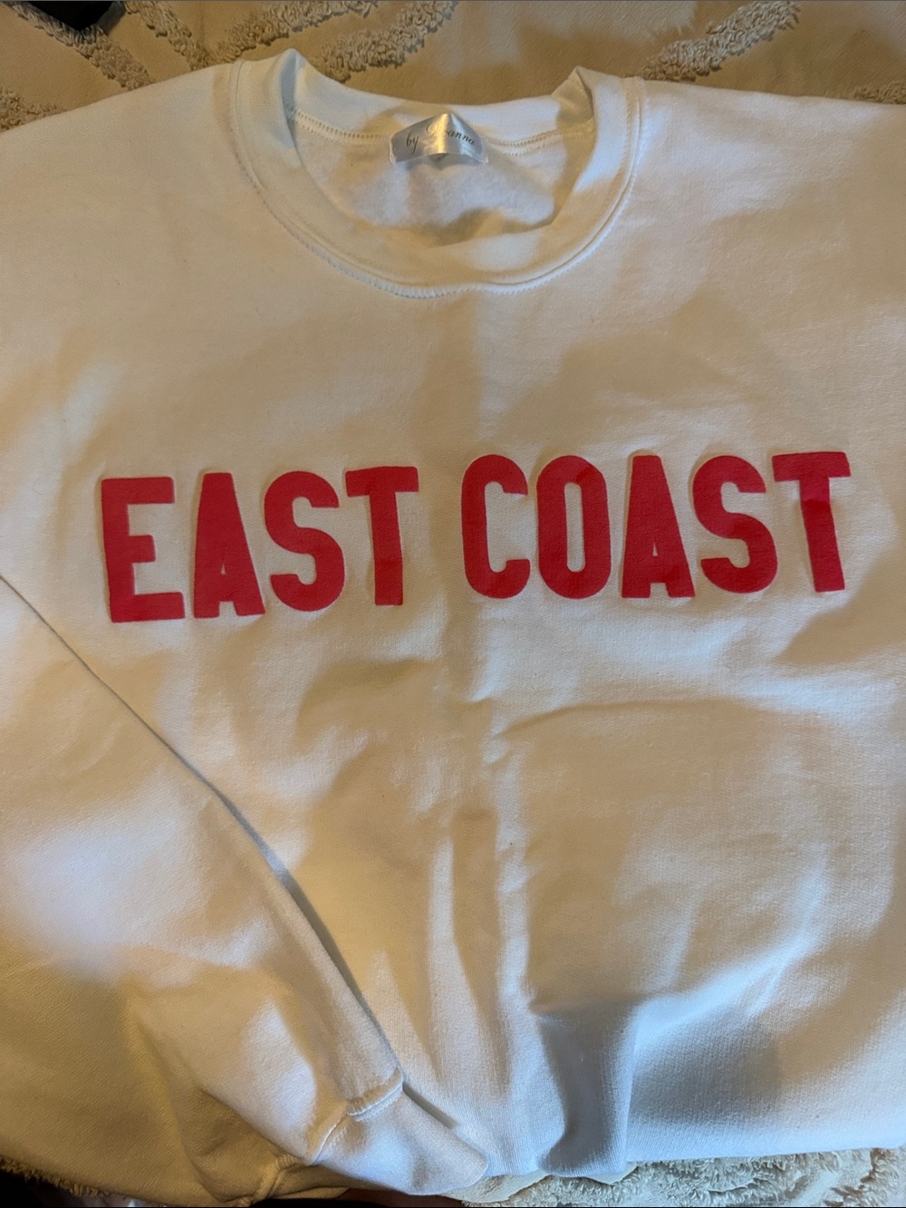 White Sweatshirt with Red EAST COAST Lettering